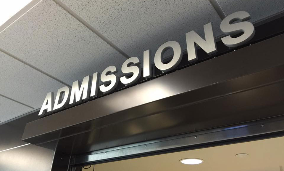 A sign that says admissions