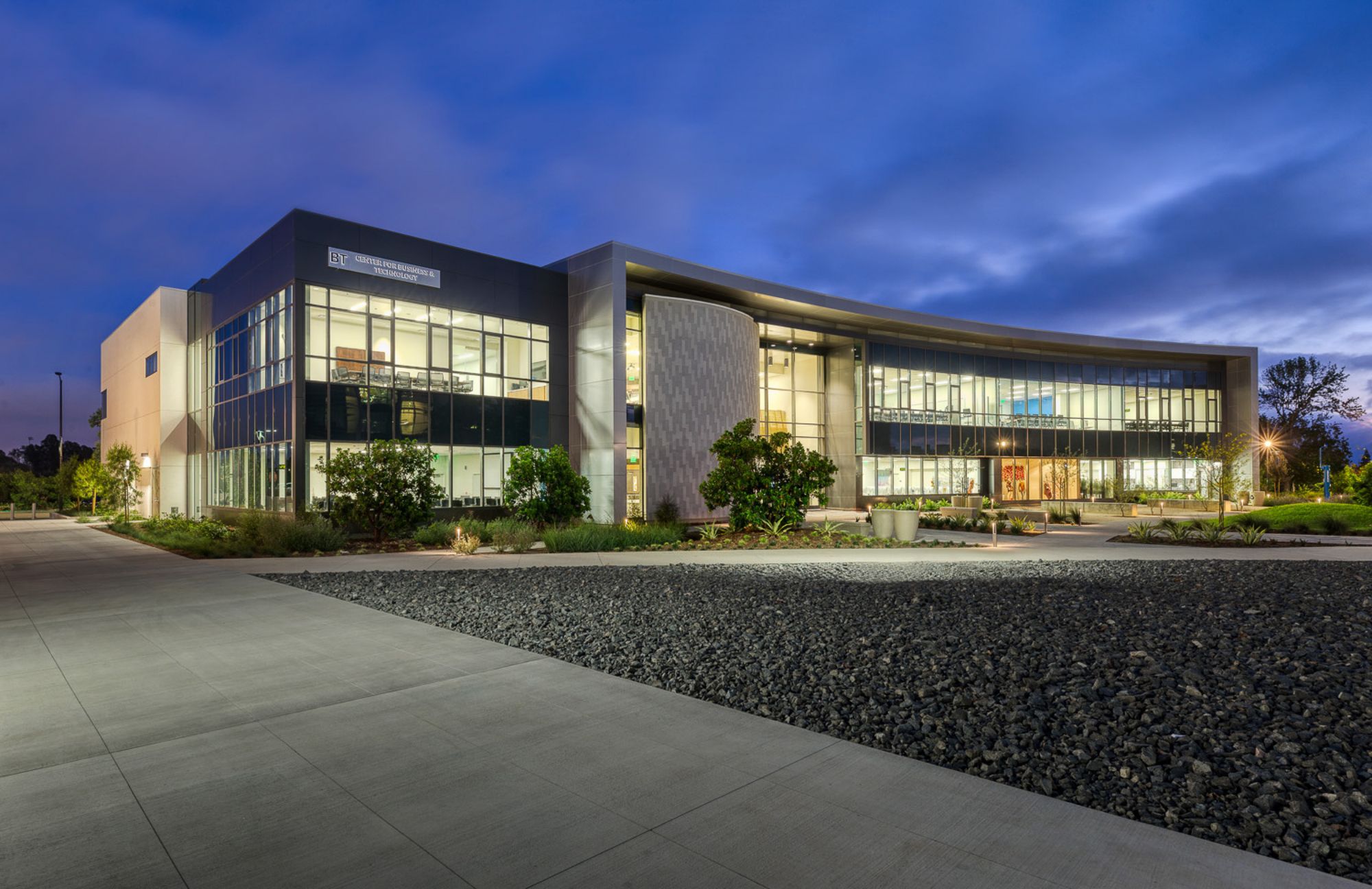 The business building at Mesa College lit up at night.