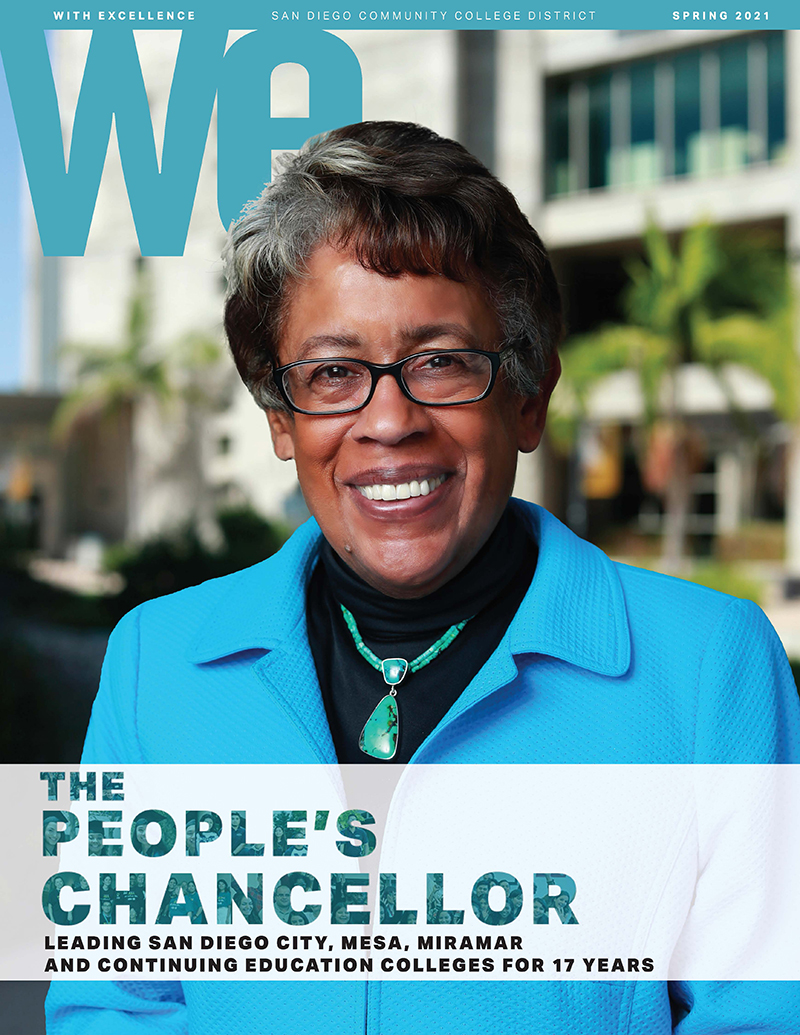Former Chancellor Constance Carroll is wearing a bright teal blazer on the cover of the spring 2021 issue of WE magazine