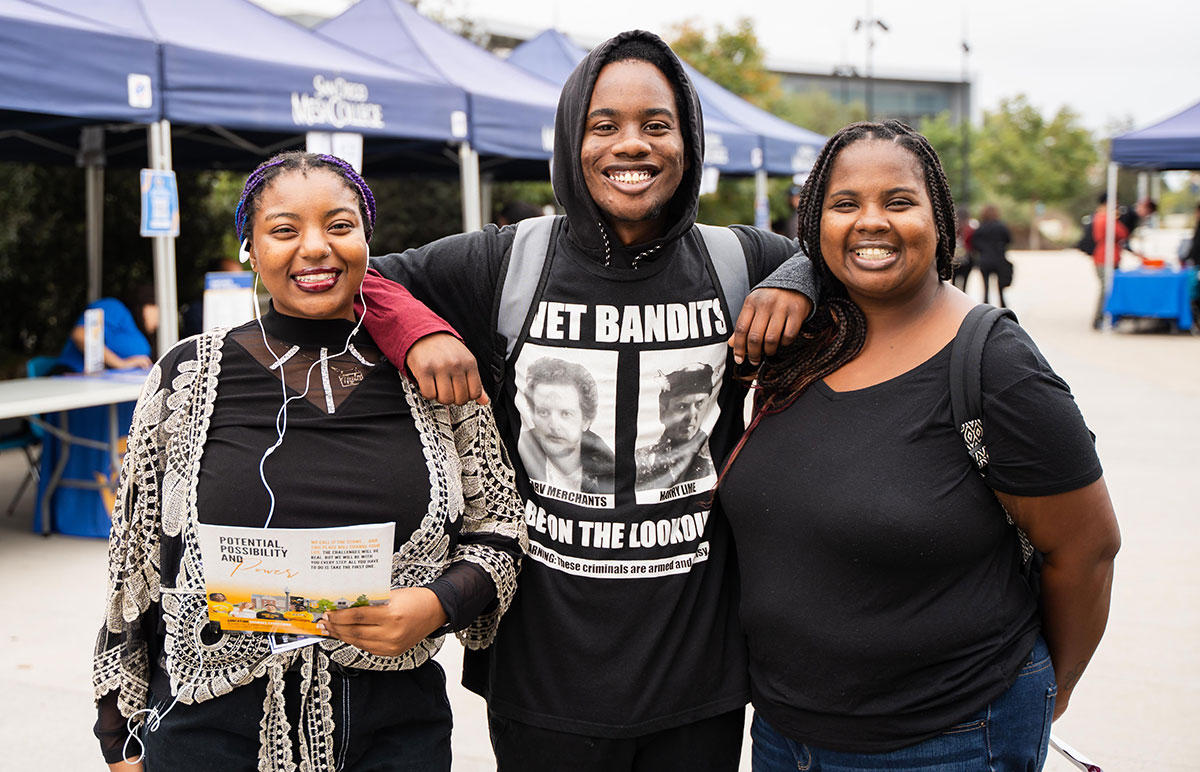 A student holds a binder for the health information management program