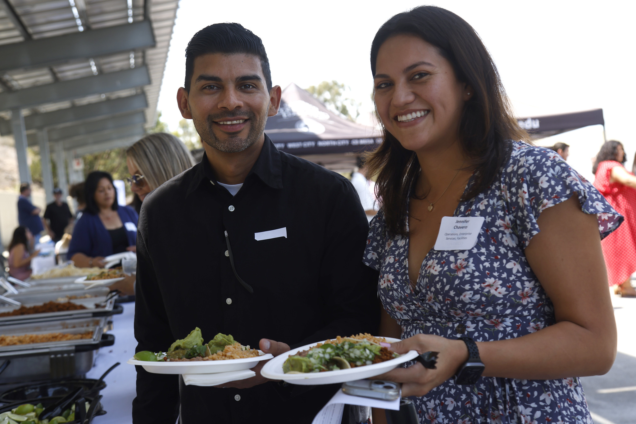 Two employees at a staff celebration to kick off the fall semester