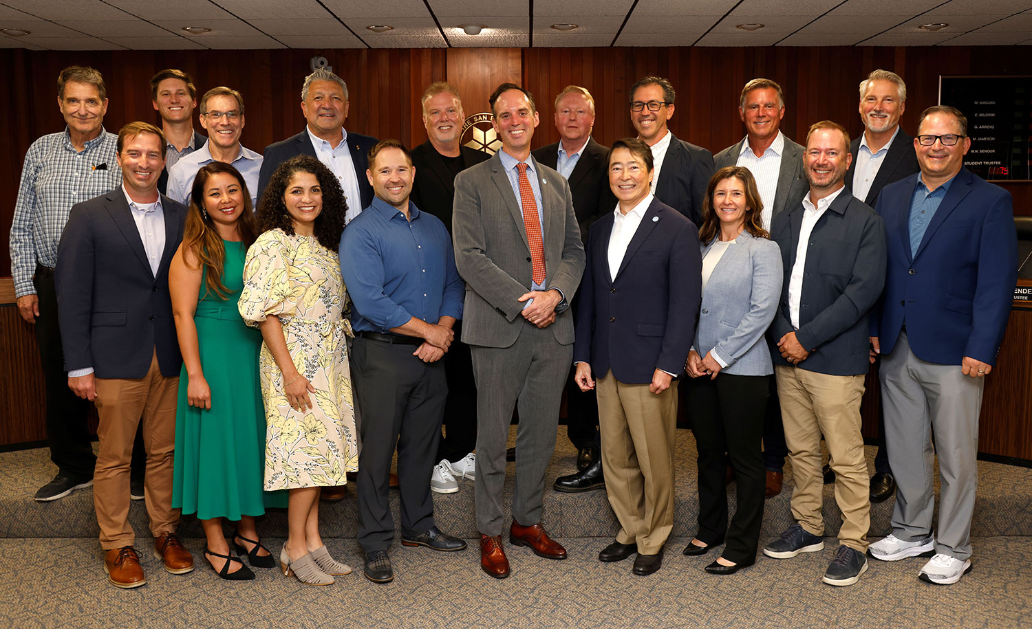 The chancellor with representatives from the firms at the board meeting