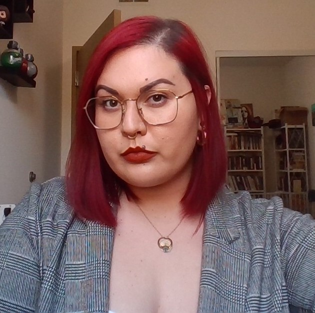 bianca negrete coba red hair red lipstick striped blazer