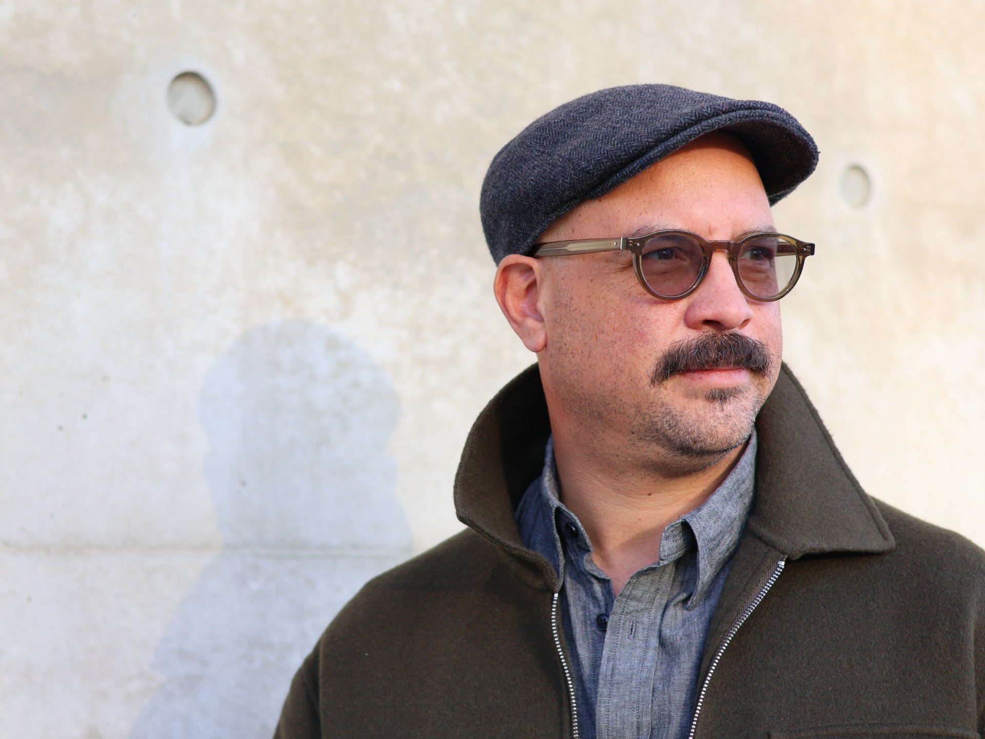 boris acosta jaramillo glasses mustache flat cap