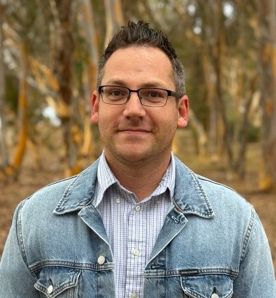 caleb mertz-vega glasses striped collared shirt jean jacket