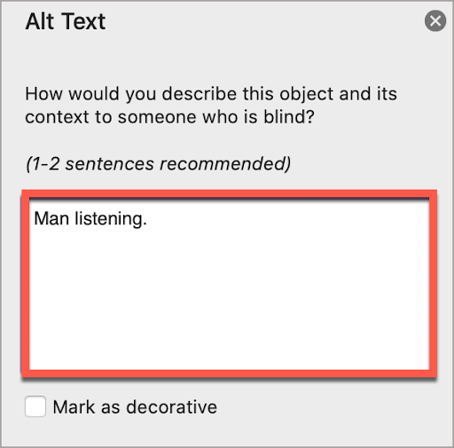 In the PowerPoint Alt Text window, write the alt text in the box. In this case, the alt text is, “Man listening.”