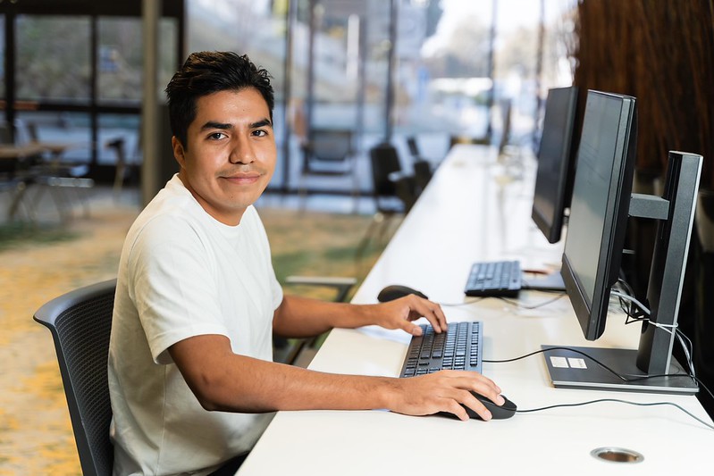 A man sitting in front of a computer