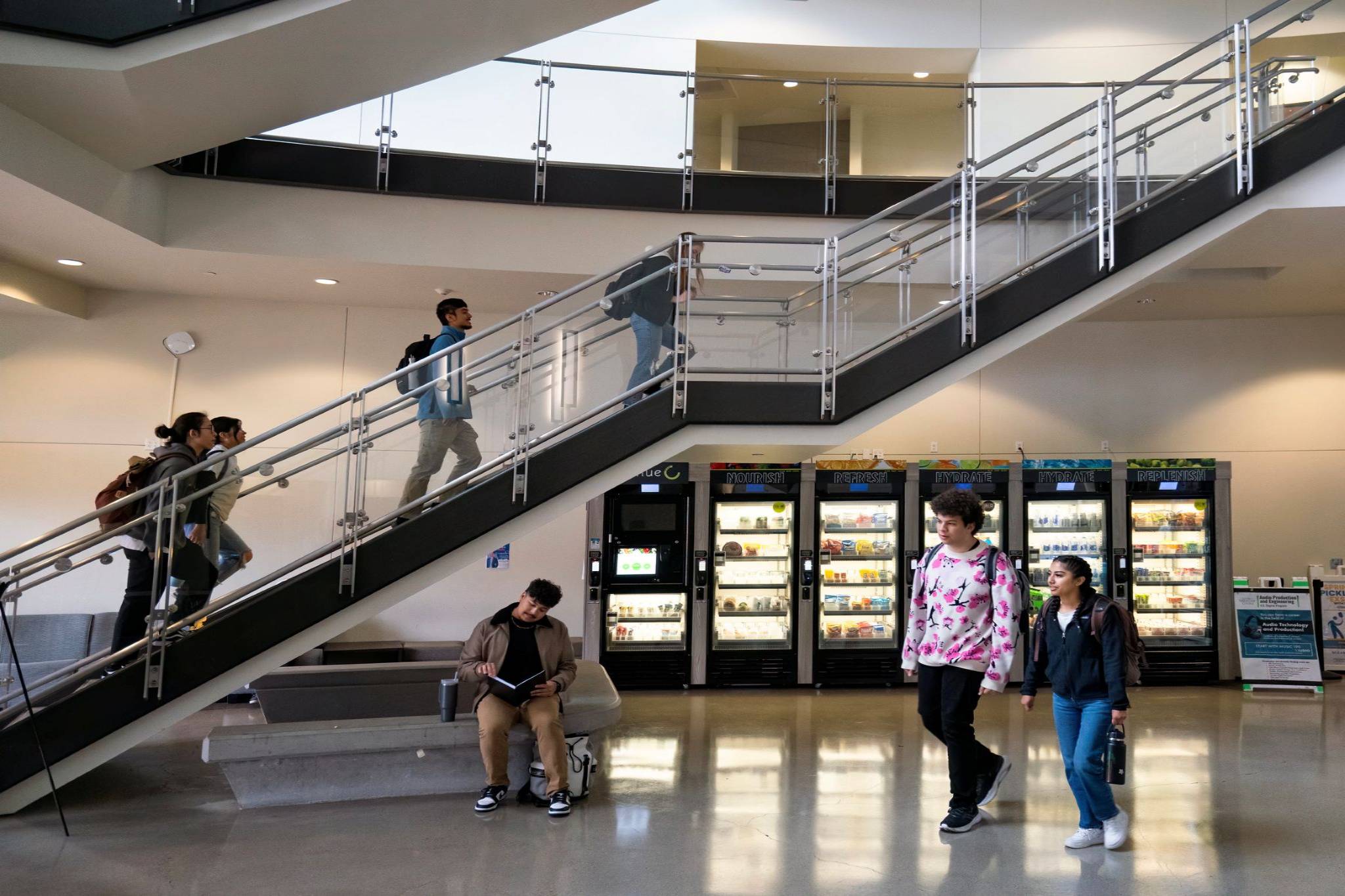 students walking through Miramar college's campus