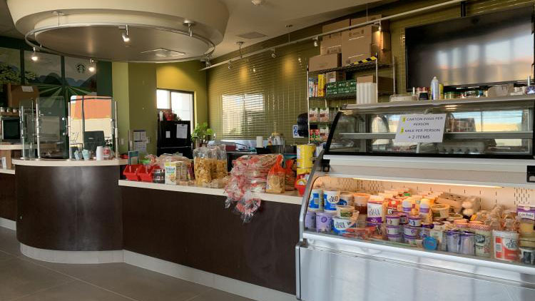 A display of chips and snacks at the Mirmar cafeteria. A kitchen is in the background