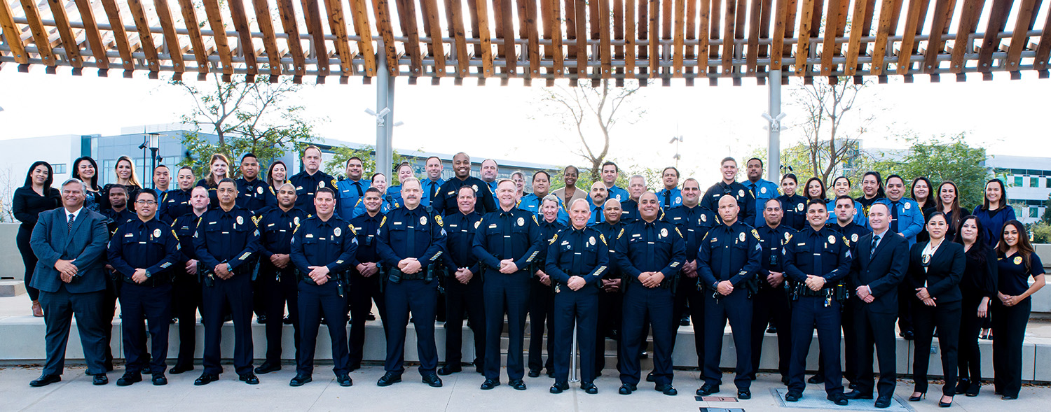 All of the police department in uniform outsite in the Mesa College quad